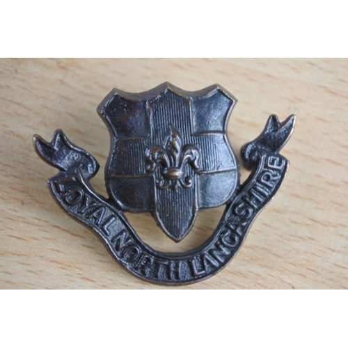 429 - A 'Loyal North Lancashire' cap badge