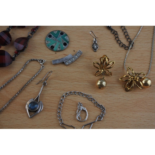 431 - An assorted lot of costume jewellery, silver and more.