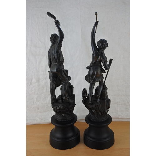 452 - A pair of metal figures on wooden plinths, stamped ASCO Approx 50cm.