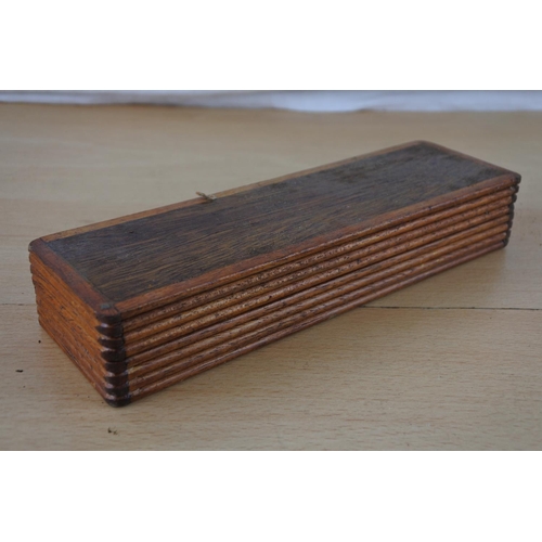 453 - A wooden cased sharpening stone.