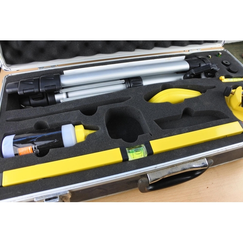 494 - A cased B & Q laser level tool kit with instruction manual and keys.