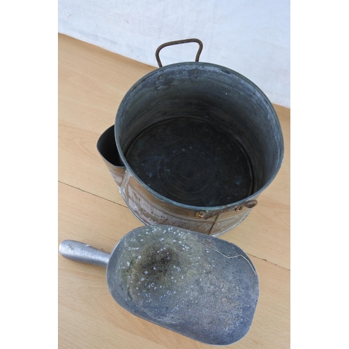 499 - A vintage meal scoop and a copper two handled pot.