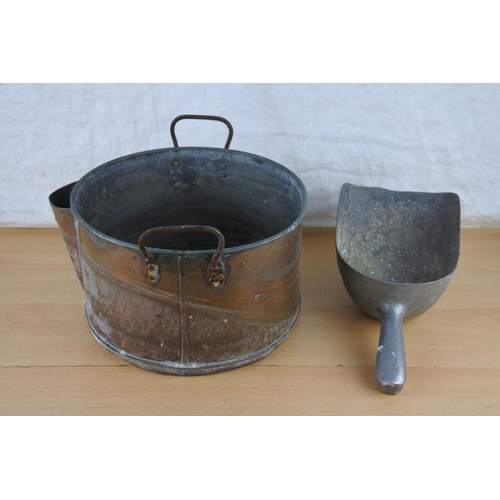 499 - A vintage meal scoop and a copper two handled pot.