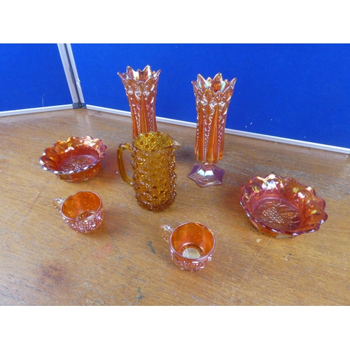 508 - A large lot of vintage carnival glass ware and a vintage amber glass jug.