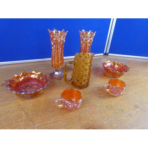 508 - A large lot of vintage carnival glass ware and a vintage amber glass jug.