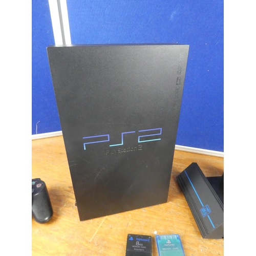 509 - A PlayStation 2 console, controllers, games and more.