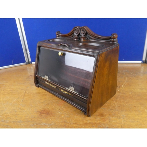 515 - A wood cased tobacco jar storage cabinet. Approx 29x39cm.