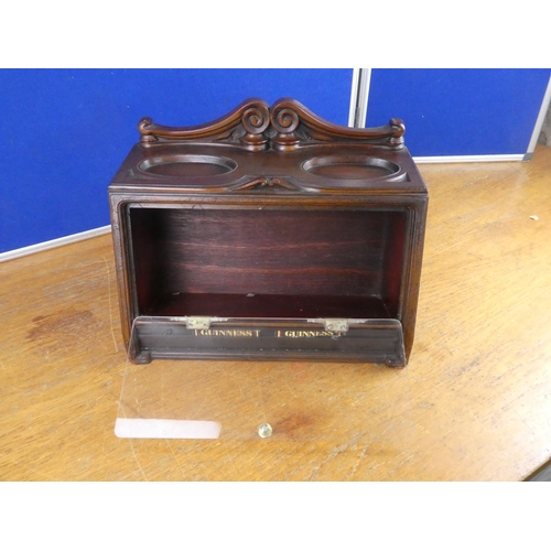 515 - A wood cased tobacco jar storage cabinet. Approx 29x39cm.