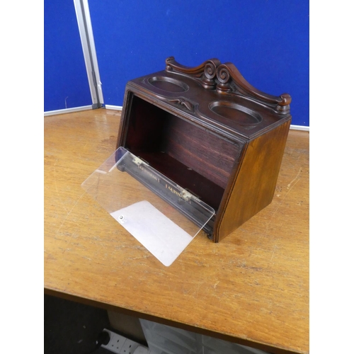 515 - A wood cased tobacco jar storage cabinet. Approx 29x39cm.