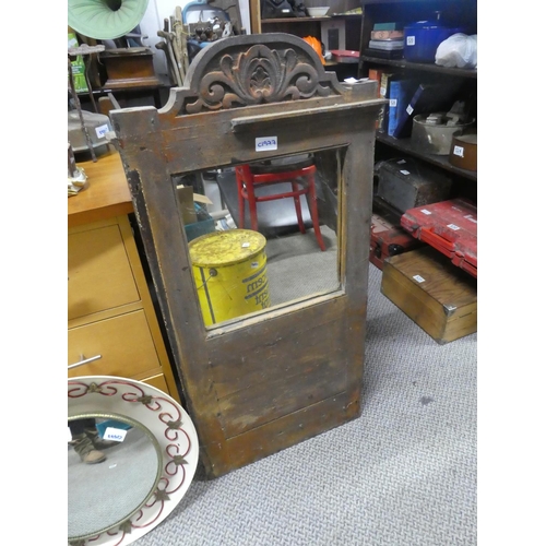 536 - An antique carved panel door with mirror either side. Approx 86x47cm.