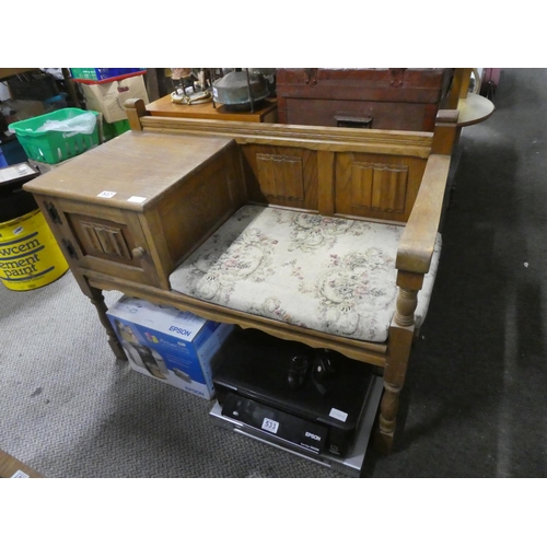 537 - A vintage oak telephone table. Approx 65x95cm.