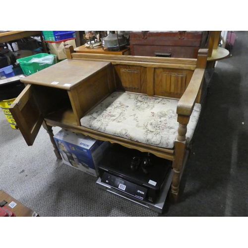 537 - A vintage oak telephone table. Approx 65x95cm.