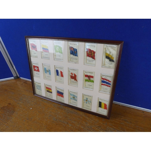 538 - A framed set of vintage silk flags. Approx  30x40cm.