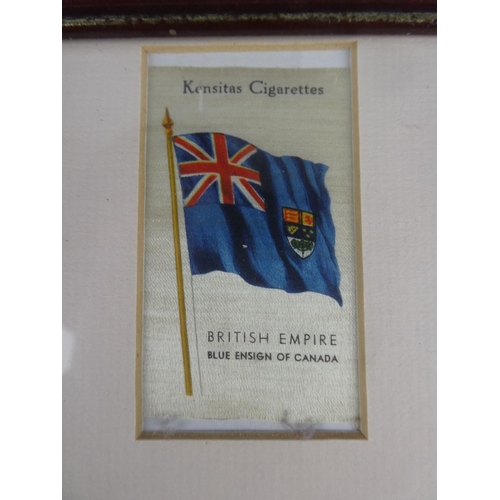 538 - A framed set of vintage silk flags. Approx  30x40cm.