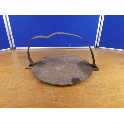 560 - An antique griddle. Approx  49cm.