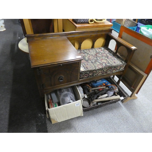 563 - A vintage oak framed telephone seat.