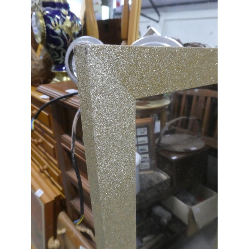 564 - A framed wall mirror with a sparkle frame.  Approx  119x28cm.