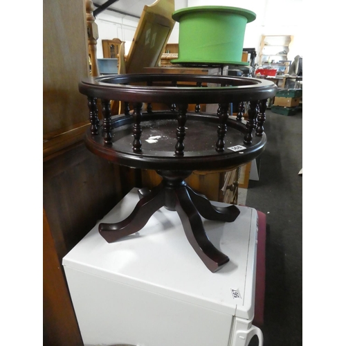 568 - A barrel shaped table plant stand.