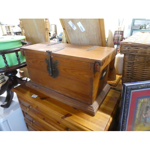 572 - A small pine storage trunk with metal work detail.