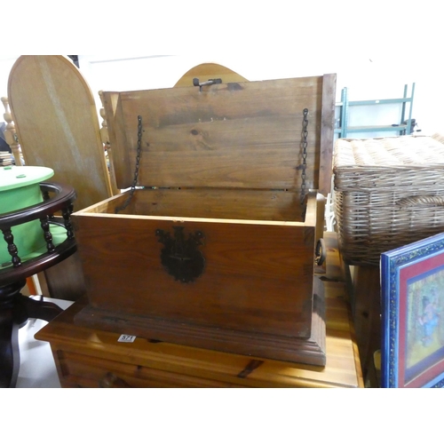 572 - A small pine storage trunk with metal work detail.