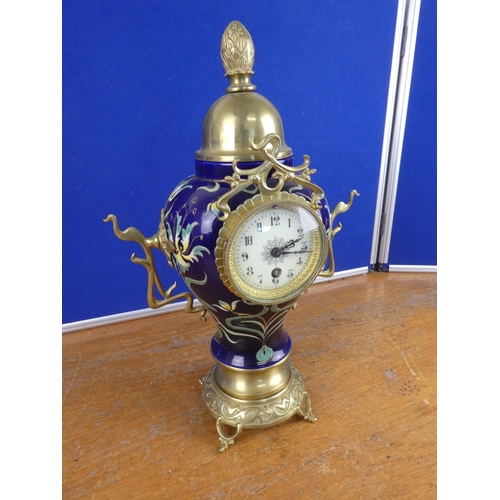 580 - A stunning French ceramic mantle clock with brass detail.