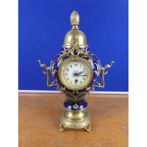 580 - A stunning French ceramic mantle clock with brass detail.