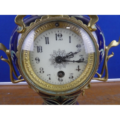 580 - A stunning French ceramic mantle clock with brass detail.