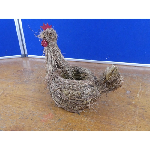 581 - A hen planter made from straw.