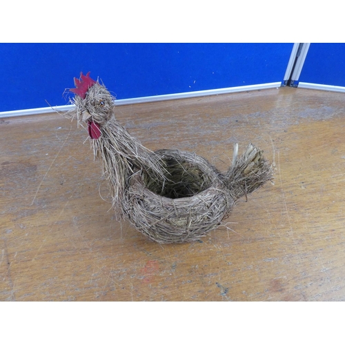 581 - A hen planter made from straw.