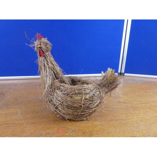 581 - A hen planter made from straw.