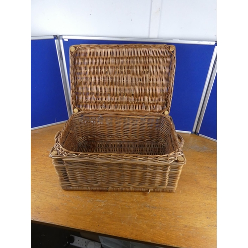 585 - A wicker storage/picnic basket.  Approx  26x56cm.