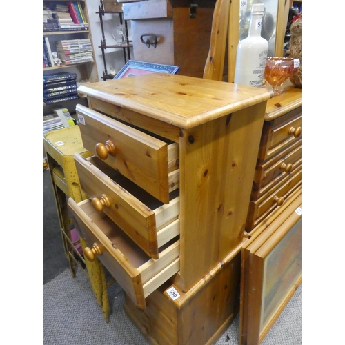 589 - A pine three drawer bedside cabinet. Approx  54x42cm.