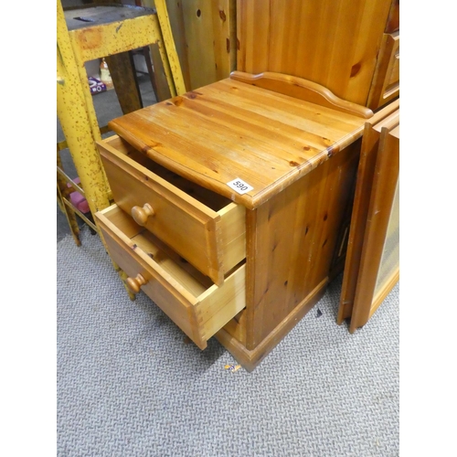 590 - A pine three drawer bedside cabinet.  Approx  59x43cm.