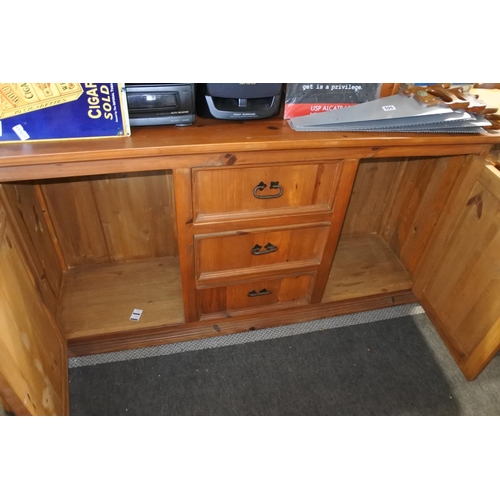 603 - A pine two door, three drawer sideboard with ironwork detail.  Approx  86x166x46cm.