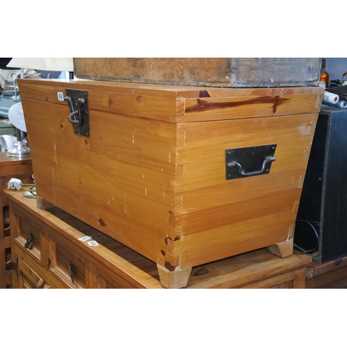 608 - A large pine storage chest with ironwork detail. Approx  46x96x46cm.