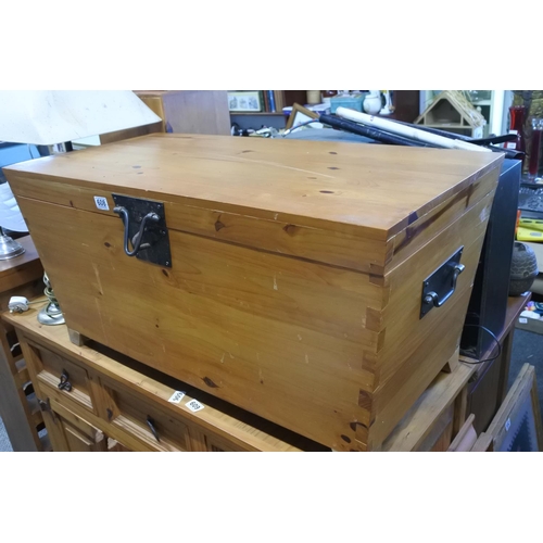 608 - A large pine storage chest with ironwork detail. Approx  46x96x46cm.