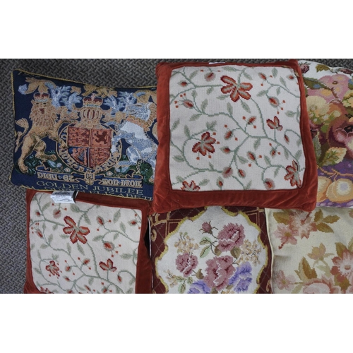 619 - Nine assorted cushions with floral detail.