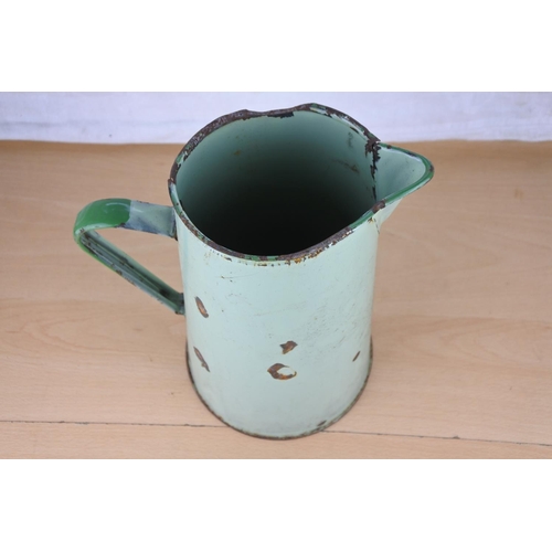 621 - A vintage green enamel water jug.  Approx  27cm.