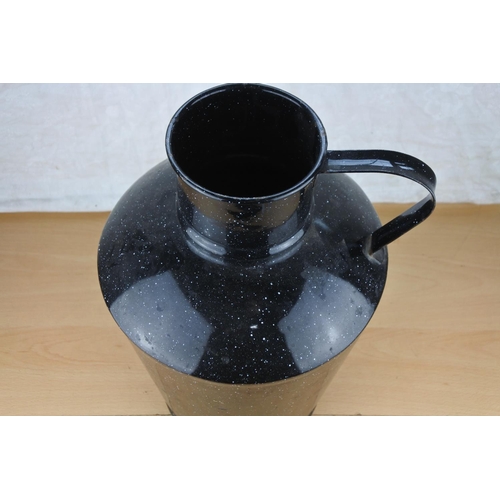 623 - A large vintage black enamel jug.  Approx  36cm.