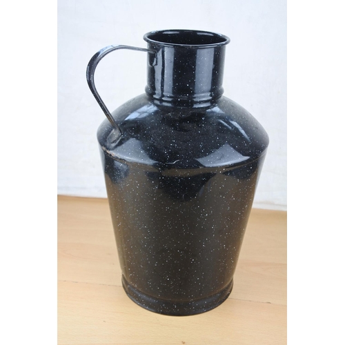 623 - A large vintage black enamel jug.  Approx  36cm.