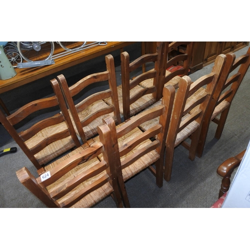 624 - A set of six pine framed dining room chairs with rattan upholstered seats and ironwork detail,