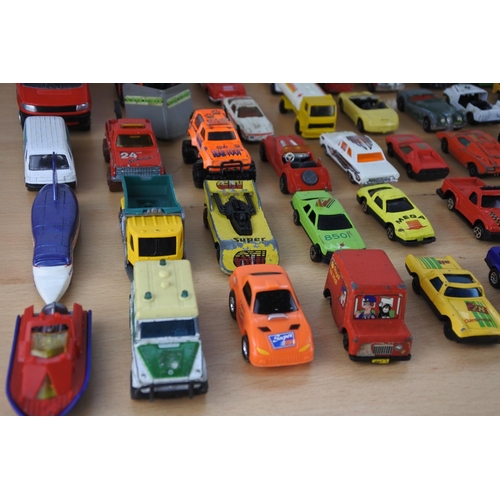 629 - A box of assorted diecast cars, trucks and more.