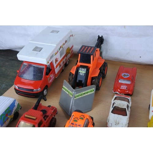 629 - A box of assorted diecast cars, trucks and more.