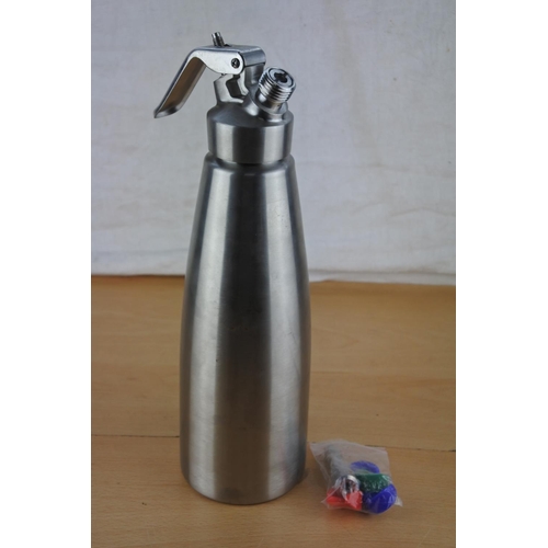 644 - A stainless steel flask with attachments.