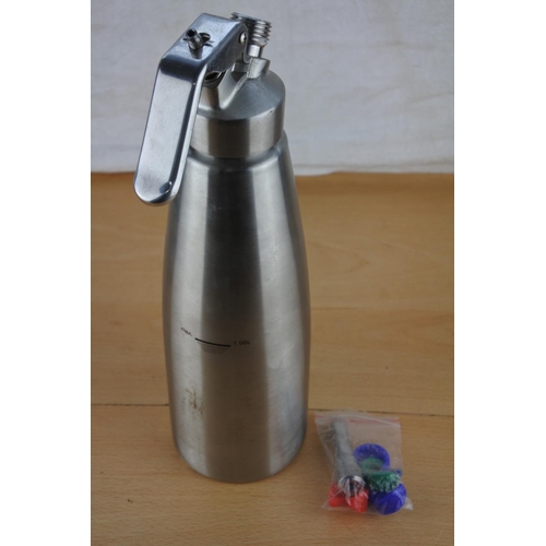 644 - A stainless steel flask with attachments.