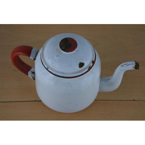 657 - A vintage white and red enamel teapot.