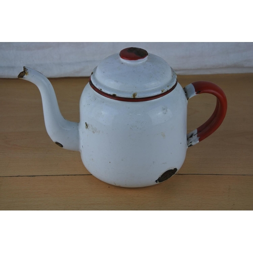 657 - A vintage white and red enamel teapot.
