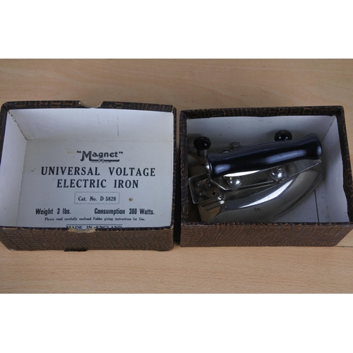 665 - A boxed vintage 'Magnet' universal voltage electric iron.