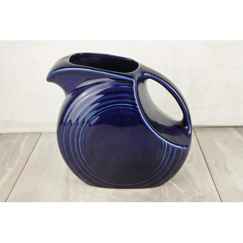 677 - A vintage Fiesta pottery jug.