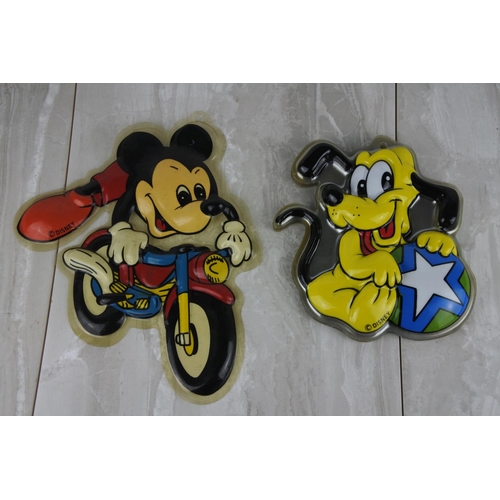 687 - A Mickey Mouse vintage cartoon character wall plaque and a lot of Pluto plastic cartoon character wa... 